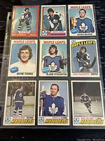 Front view of 9 Toronto Maple Leafs collectible hockey trading cards featuring players in uniform and team graphics.