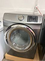 Front view of silver Samsung front-load dryer