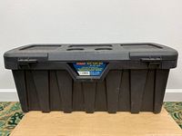 Front side view of black Contico SUV Tuff Bin with product label.