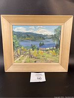 Framed original oil painting showing the full Canadian landscape scene with lake and hills.