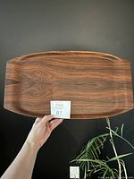 Top view of mid century rectangular wooden tray with visible wood grain and smooth finish.