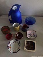 Overview of coffee server, cream jugs, and appetizer dishes arranged on a table