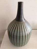 Front view of the large ceramic vase showing its shape and striped pattern.