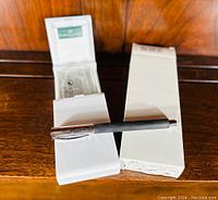 Faber-Castell fountain pen resting on box showing full pen and packaging.