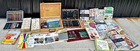 Overview of wooden and aluminum cases, paint boxes, coloring set, pads and books