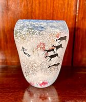 Front view of oval art glass vase showcasing painted deer and archer design on sandblasted surface.