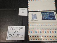 Lot of 25 United Nations First Day Covers shown in an album with handwritten note indicating lot number