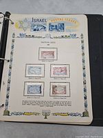 Album page showing Israel Festival Issue stamps with five stamps featuring dolphin designs in various denominations.
