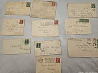 Front side of 10 vintage U.S. postal covers/envelopes with various stamps and handwritten addresses
