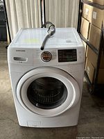 Front view showing the door, control dial, and digital panel with details of washing modes.