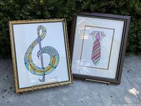 Both framed Zentangle artworks with the two wooden easels placed outside, showing the entire lot together.