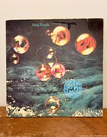 Front cover of the Deep Purple 'Who Do We Think We Are' vinyl album showing bubble-themed artwork with wear and scuffs.