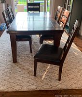 Assembled table with chairs in room setting