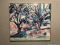 Full framed print showing abstract tree landscape in blue, pink, and purple tones with collection label.