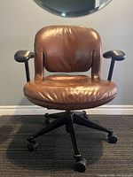 Front view of chair showing seat, backrest and base