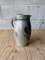 Alternate side view highlighting the shape and condition of the pitcher