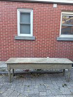 Full-length front view showing entire tabletop and turned legs