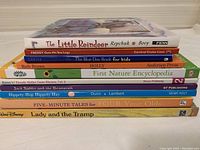 Stack of 10 children's books showing titles and publishers on spines