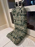 Side angle view showing cushion shape, thickness, and fabric pattern