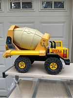 Side view of vintage Tonka Turbo-Diesel cement mixer truck showing metal cab, large plastic mixer drum and decals