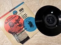 Black vinyl record with Decca Records label shown next to album cover.
