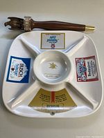 White divided ceramic serving tray with four compartments showing beer logos and central round bowl with 1978 Sales Convention gold emblem.