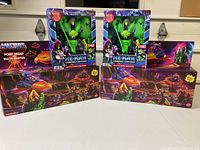 Lot contents showing two boxed He-Man figures and two boxed Point Dread and Talon Fighter sets.