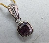 Front view of rhodium-plated 14K white gold pendant featuring cushion cut pink diamond