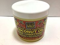 Photo of the front label of the 12 oz jar of African Gold Super Rich Formula Coconut Oil Hair Conditioner showing brand, product name, and product claims.