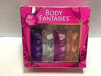 Front view of boxed set of four Body Fantasies body sprays with visible scent names and packaging details.