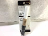 Front view of Covergirl Vitalist Healthy Concealer 3ml pen in 785 Light/Medium shade sealed in retail packaging, showing product name and volume.