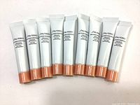 Nine tubes of Shiseido Bio-Performance LiftDynamic Eye Treatment, front view showing labels and peach caps.