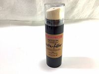 Front view of Revlon Photoready Insta-Filter foundation bottle showing sponge applicator cap and product label.