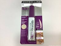 Front view of Maybelline The Falsies Lash Mask in original packaging showing purple and white tube, branding, and product details.