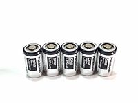 Front view of five Panasonic CR2 lithium batteries arranged in a row, showing positive terminals and labeling.