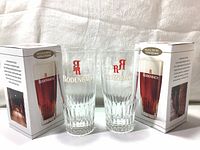 Two Rodenbach beer glasses with their original branded boxes.