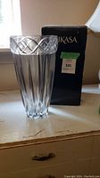 Clear crystal Mikasa vase with Infinity Band style silver pattern on rim, displayed next to original black Mikasa box.