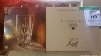 Photo of the boxed set of Cristal d'Arques Cassandra 4 beverage glasses with a picture of one etched glass.