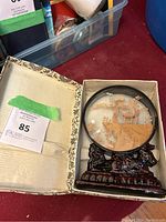 Full view of Oriental cork art in original box showing the cork scene and carved stand.