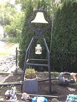 Full front view of bell and stand assembly outdoors