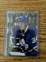 Front side of the Auston Matthews rookie card showing player image and branding details.