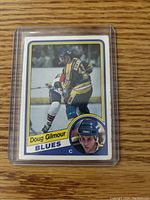 Front of the 1983-84 Doug Gilmour O-Pee-Chee rookie card showing him in St. Louis Blues uniform