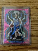 Front of the Prizm rookie card showing Josh Giddey in Oklahoma City Thunder uniform with pink cracked ice holographic pattern.