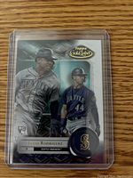 Front of Julio Rodriguez baseball rookie card in protective plastic case showing player images and branding