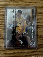 Front of the Kobe Bryant trading card showing image and protective coating text