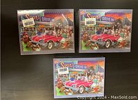 Three new boxed puzzles titled 'Let's go! Dogs' arranged in a triangle on a black surface, showing front artwork with dogs and a red car in a drive-in scene.