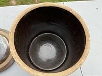 Top view showing interior of the ceramic crock pot, glossy and dark glazed inside.