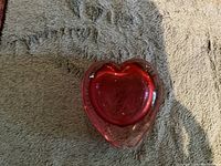 Top view of cranberry glass heart-shaped vase showing the heart shape clearly and the depth of the glass.