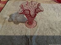 Front view of pink Victorian hobnail glass vase showing ruffled top and hobnail texture