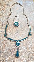 Taxco sterling silver necklace and ring set showing turquoise inlay.